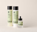 The three Age-Well products together: shampoo, conditioner and dropper serum