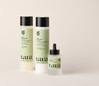 The three Age-Well products together: shampoo, conditioner and dropper serum