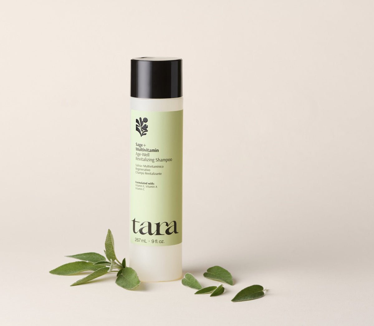 The shampoo bottle beside cut sage leaves